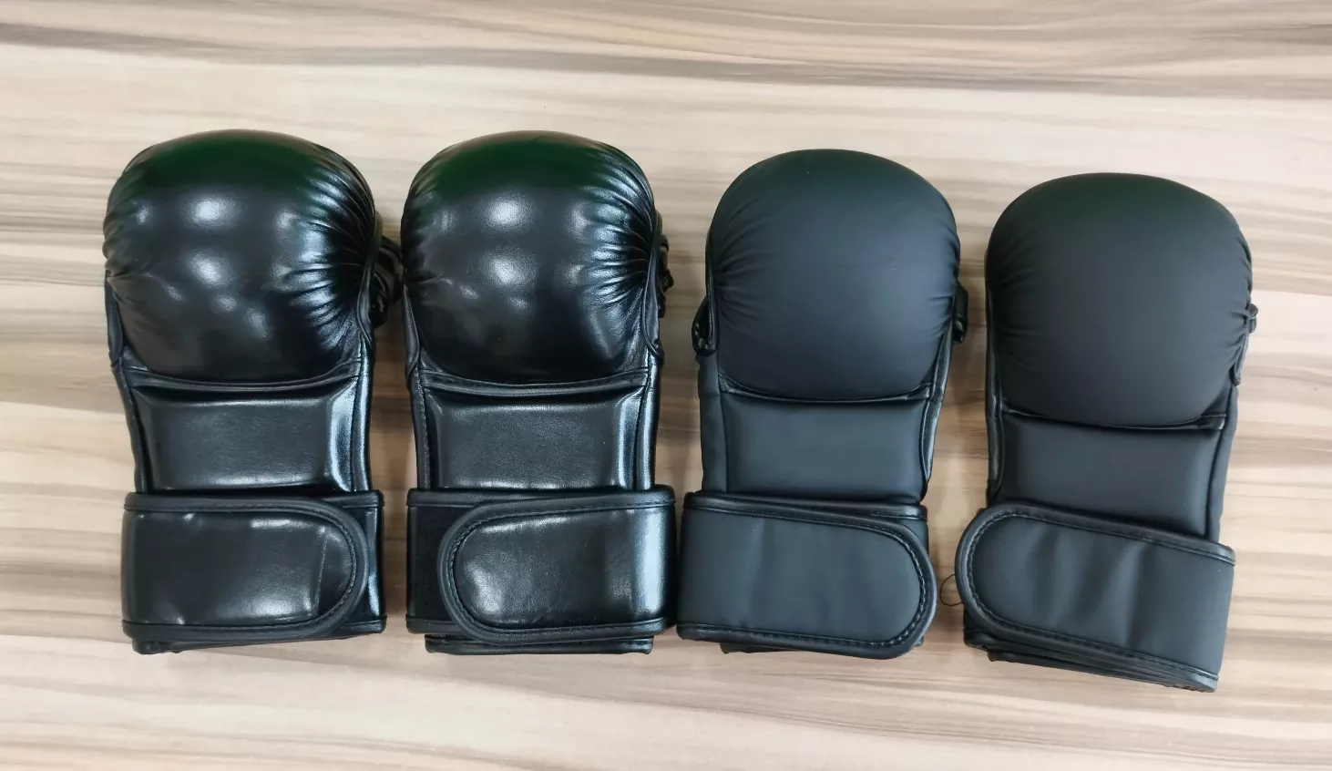 MMA training gloves showing open-palm design and wrist strap closure